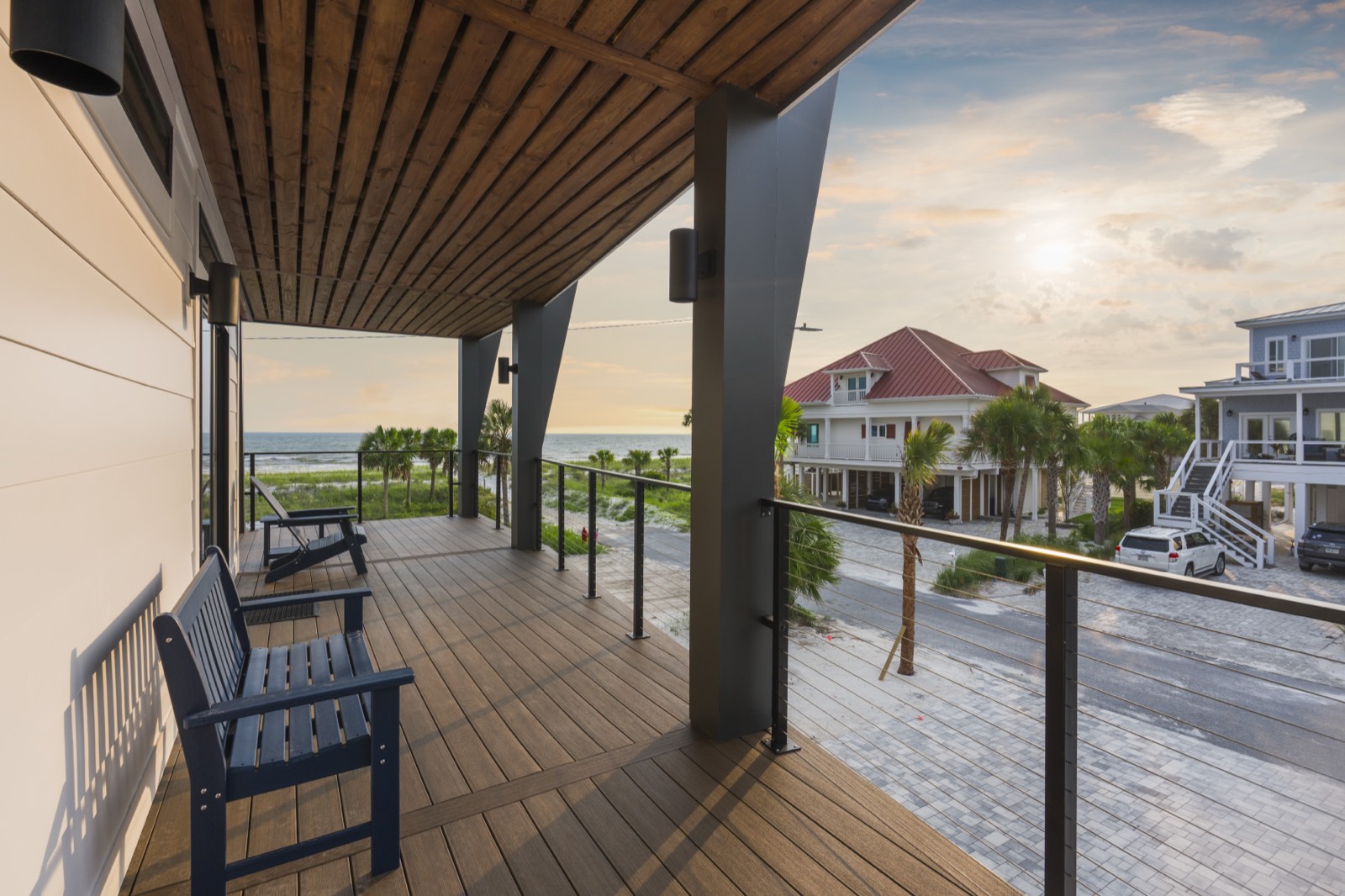 Vacation rental porch at sunset overlooking the beach community