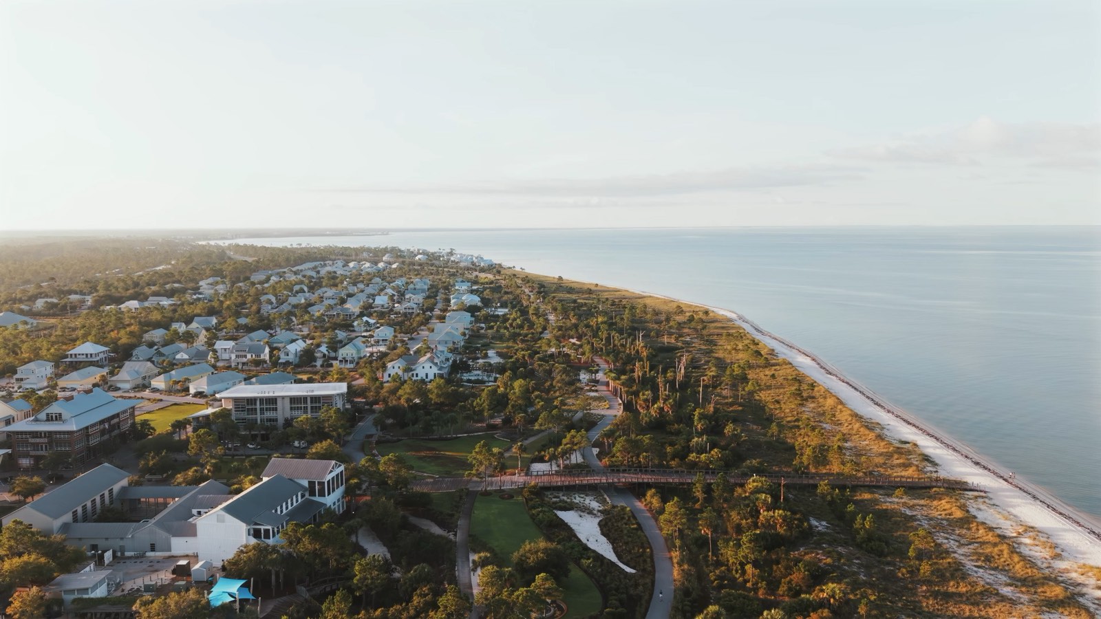 Drone aerial along the Gulf Coast shoreline at sunrise
