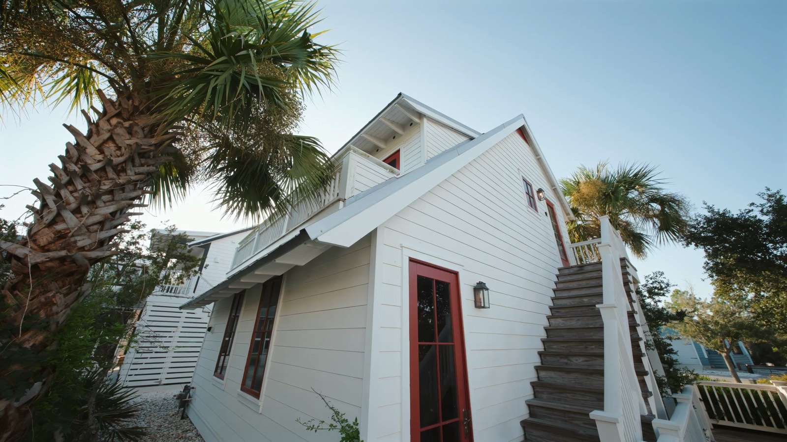 Low-angle architectural exterior of a coastal Florida listing